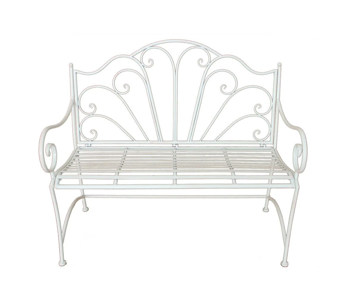Antique cream metal garden bench with decorative scrollwork and a hand-distressed finish