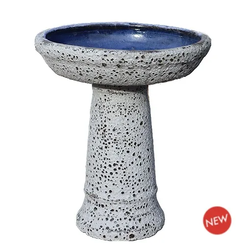 White Coral textured pedestal birdbath with dark blue bowl interior
