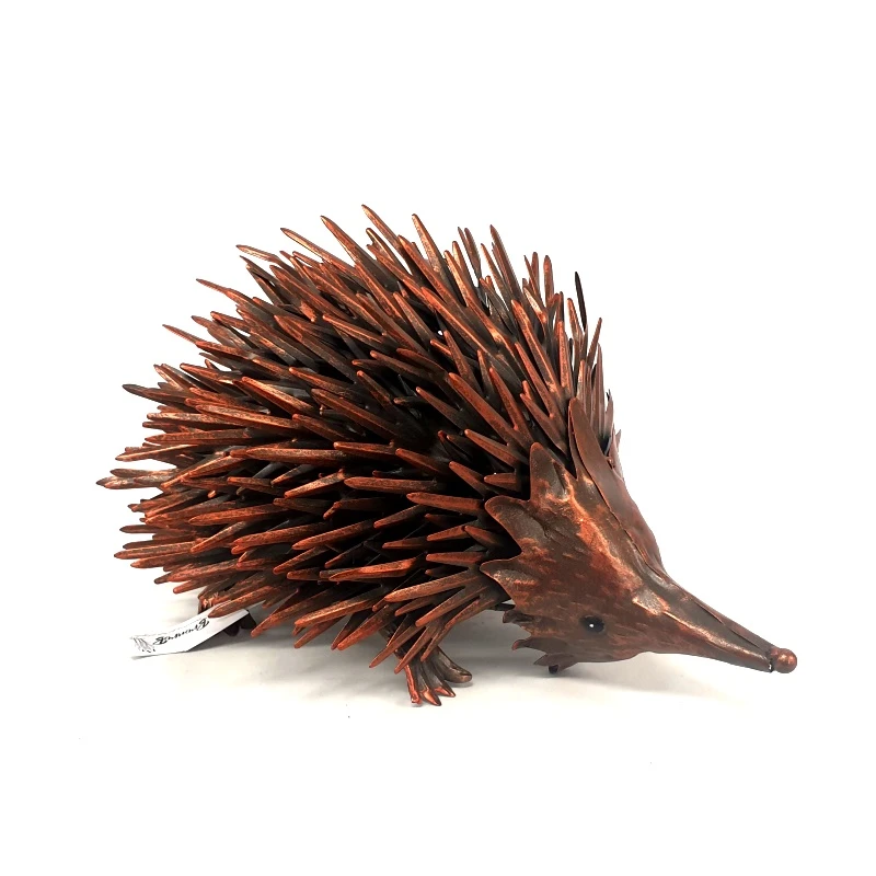 Bronze rustic echidna garden sculpture side view on white background